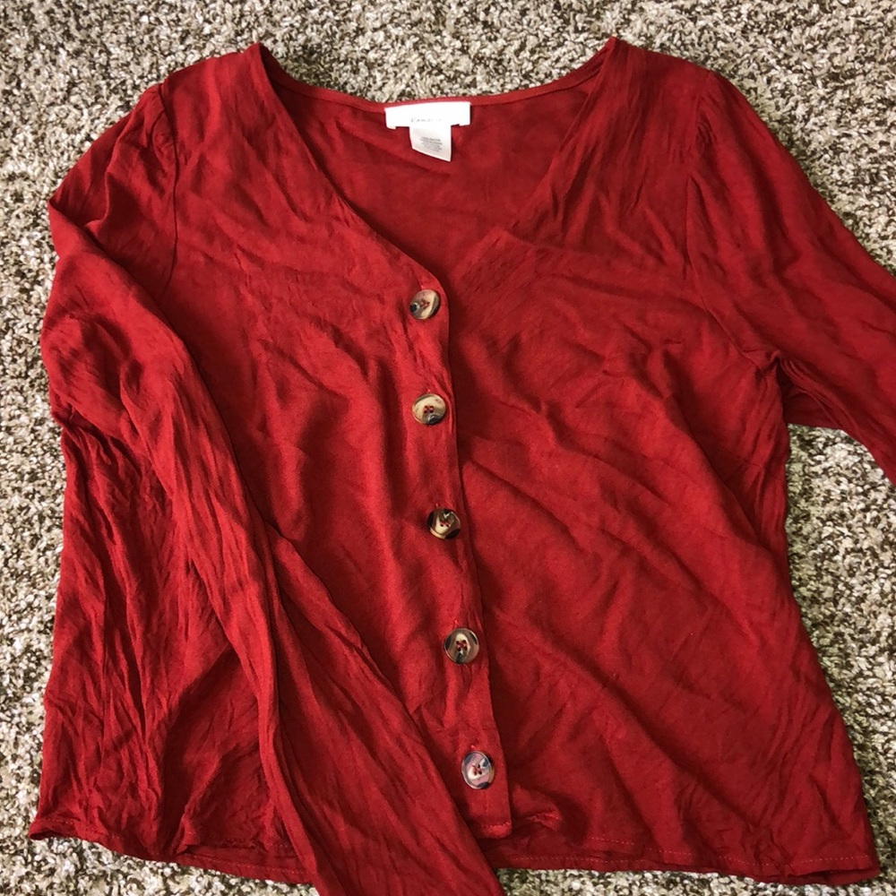 burnt orange/red blouse